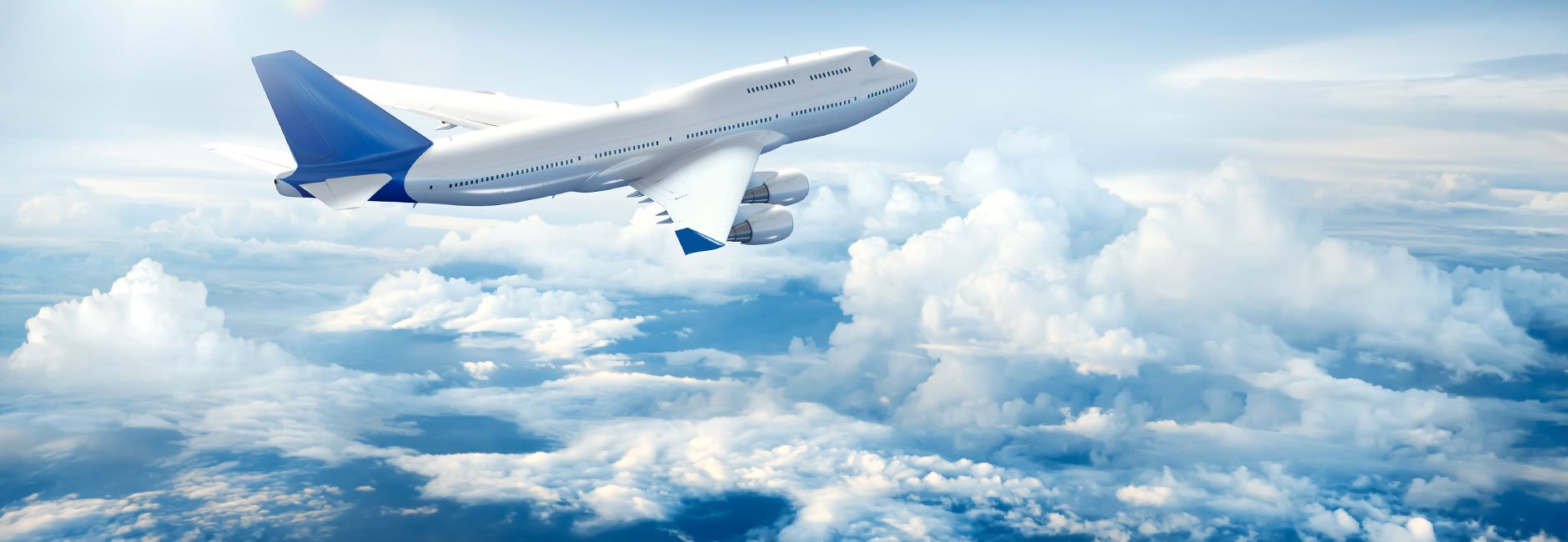 Airplane flying above clouds